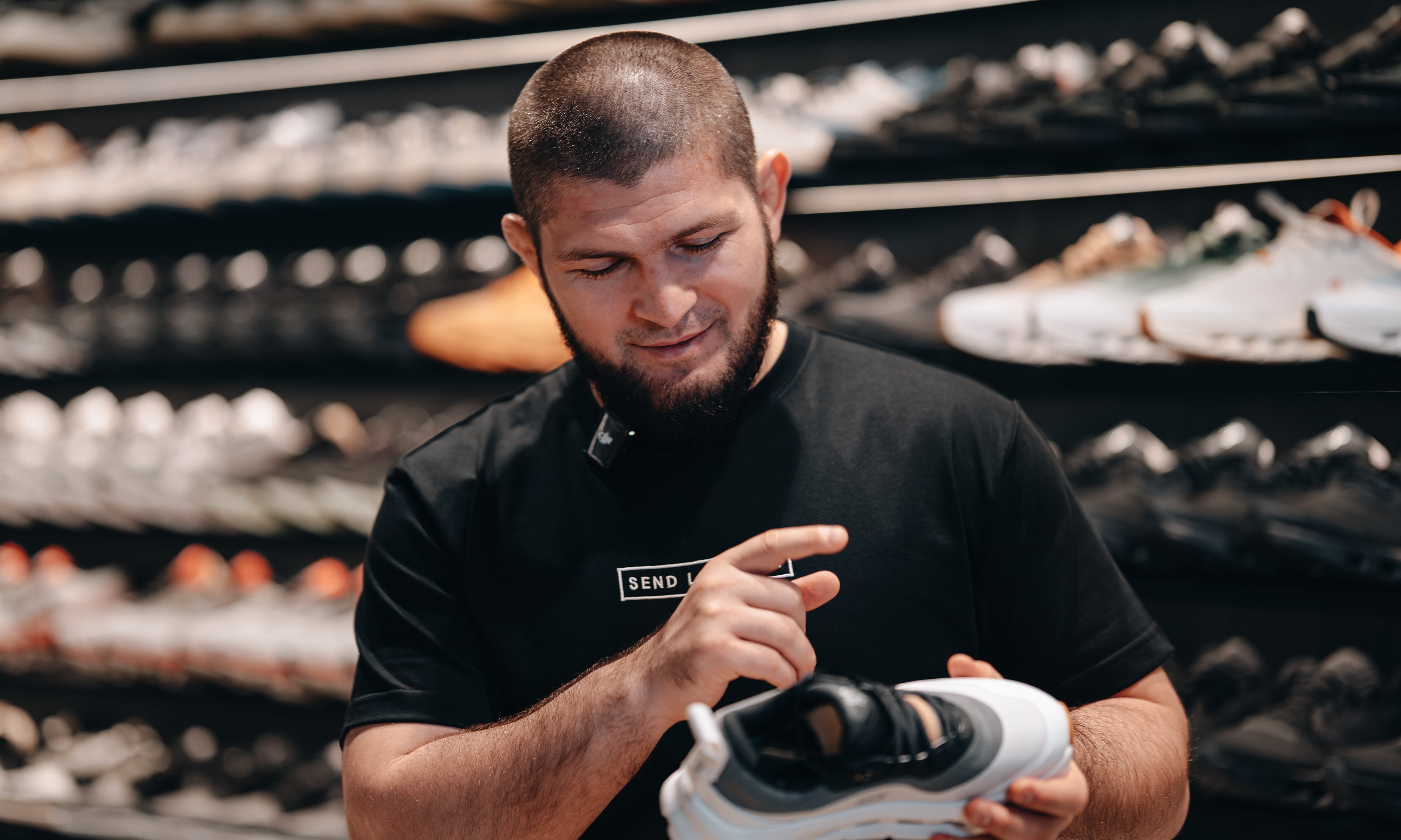 Checking the fit of a sneaker at Send Location, Dubai