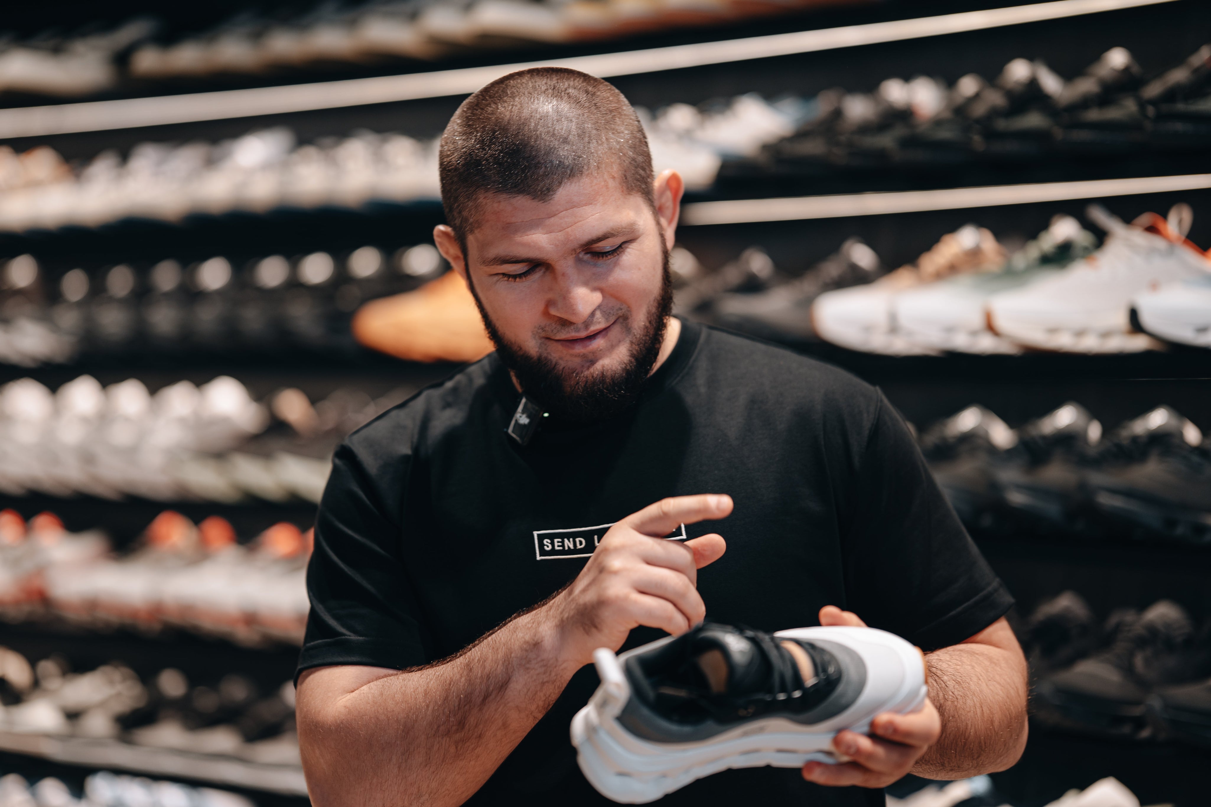 Checking the fit of a sneaker at Send Location, Dubai